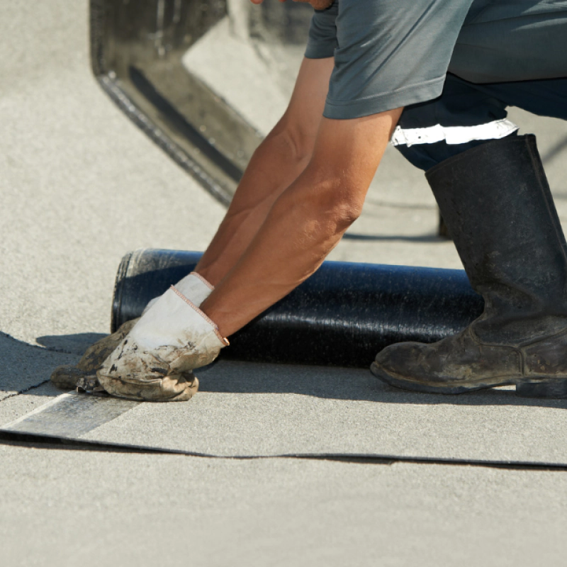 man working on flat roof